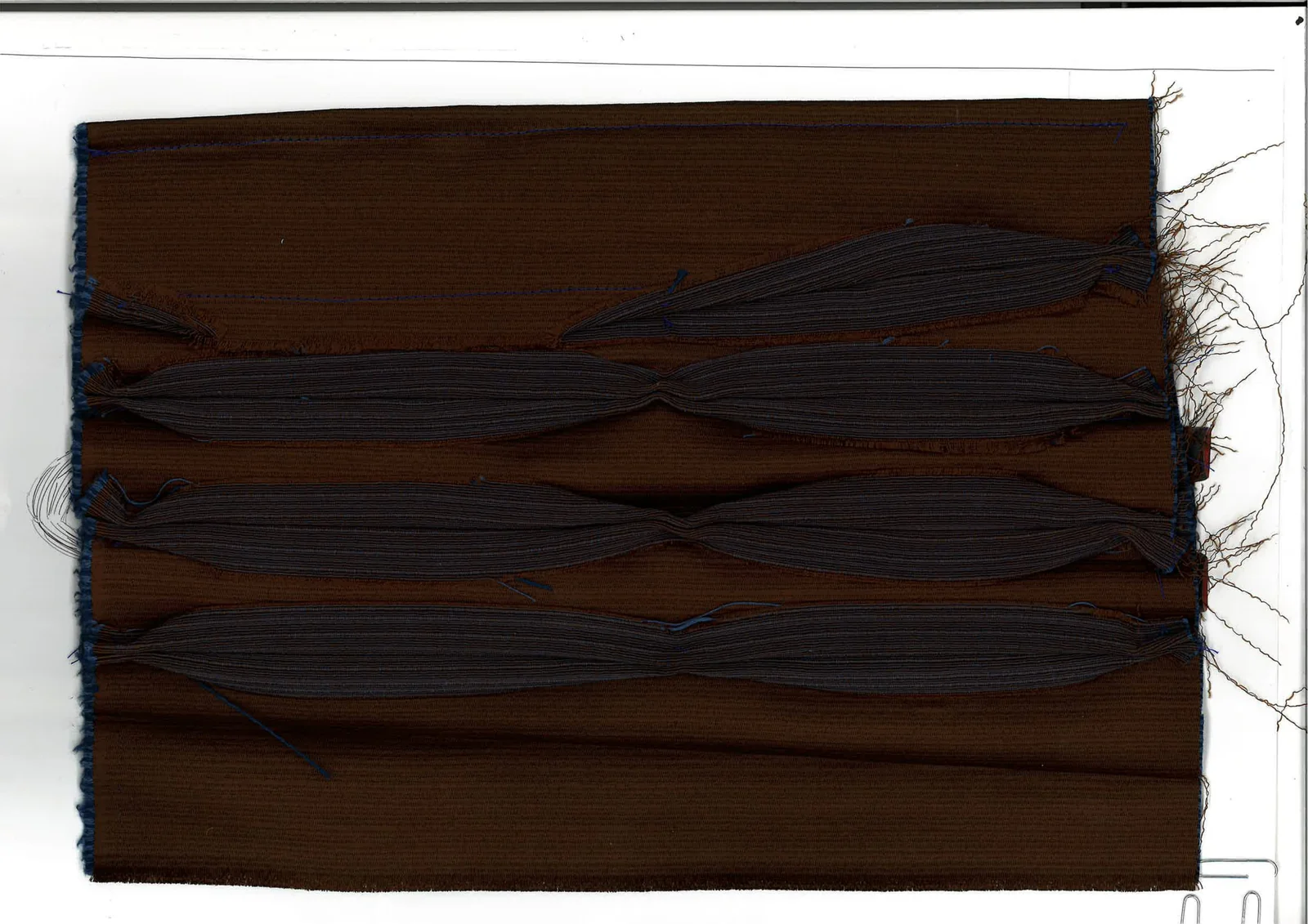 The Elon Musk Fit's brushed double-sided fabric strip, the weave shown macro