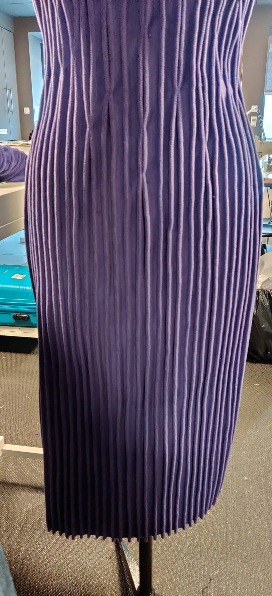 The Receptionist Charm's pintuck pleating at the back seam, shown on a dress form