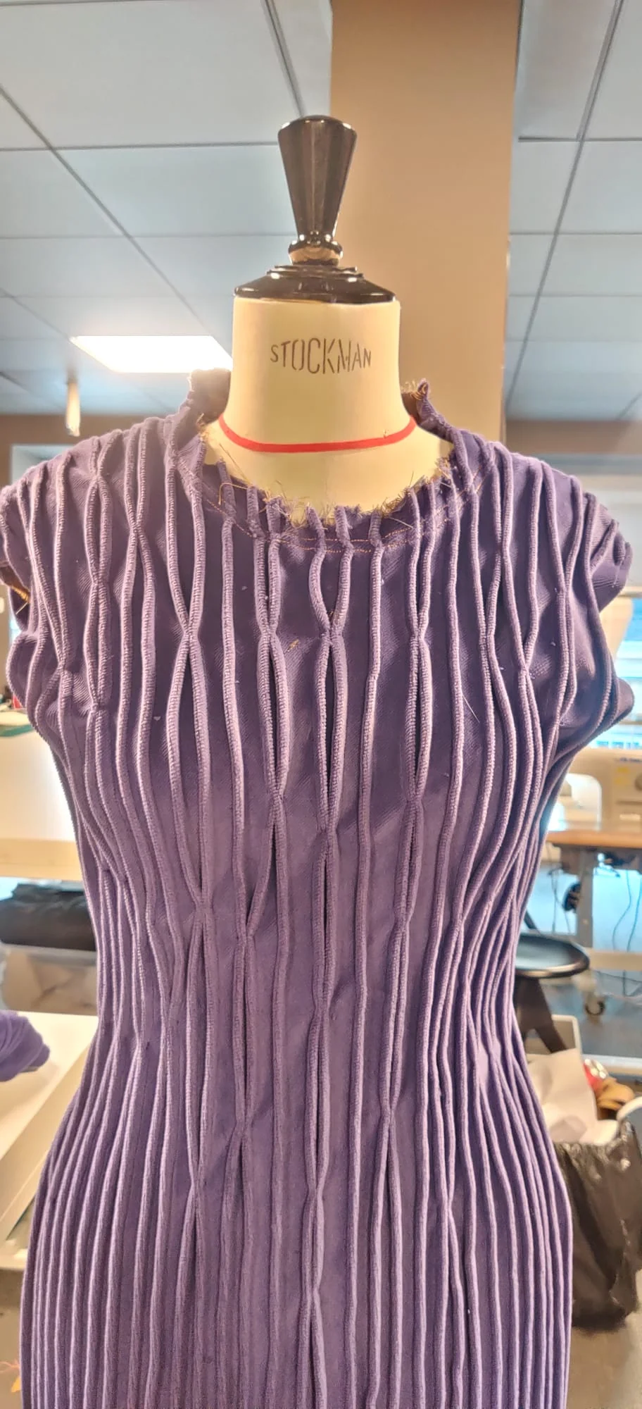 The Receptionist Charm's gathered neckline construction, shown on a dress form