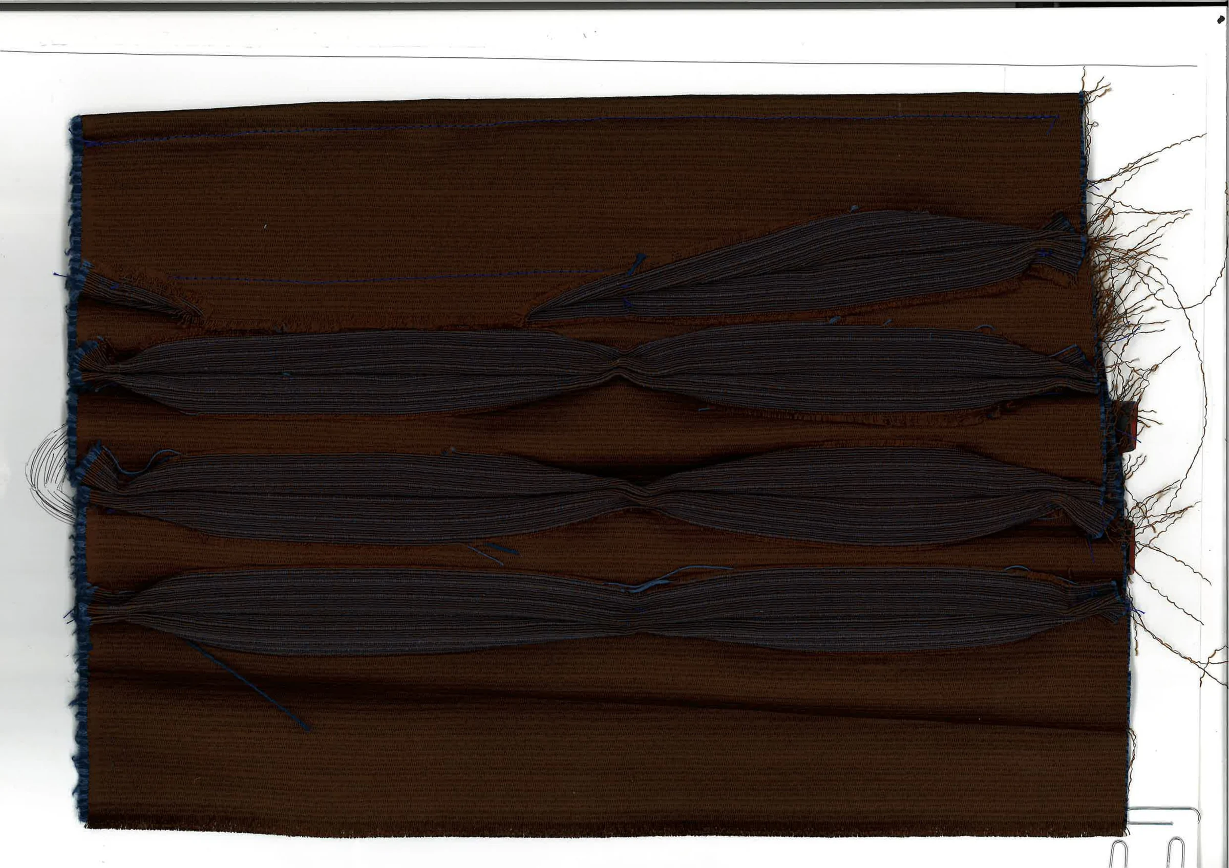 Manipulated double-sided upholstery fabric swatch with raised surface